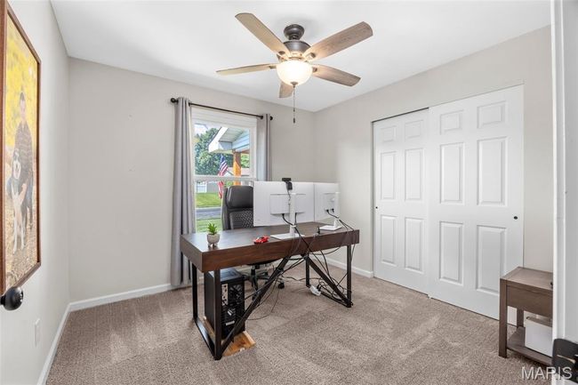 Home office with a ceiling fan and carpet floors | Image 22