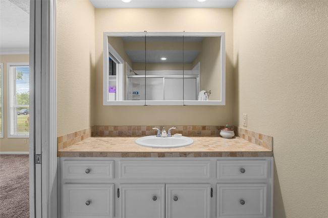 Bathroom with vanity and walk-in shower | Image 22