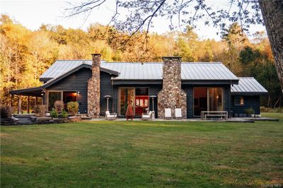 side of house featuring a lawn | Image 3