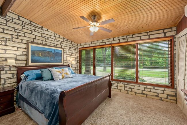 Carpeted bedroom featuring wood ceiling and vaulted ceiling | Image 18