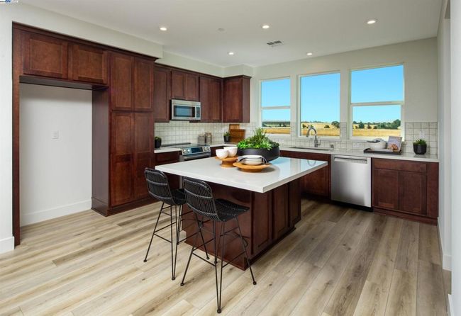 Photo is of the model home and not the actual home for sale. | Image 8