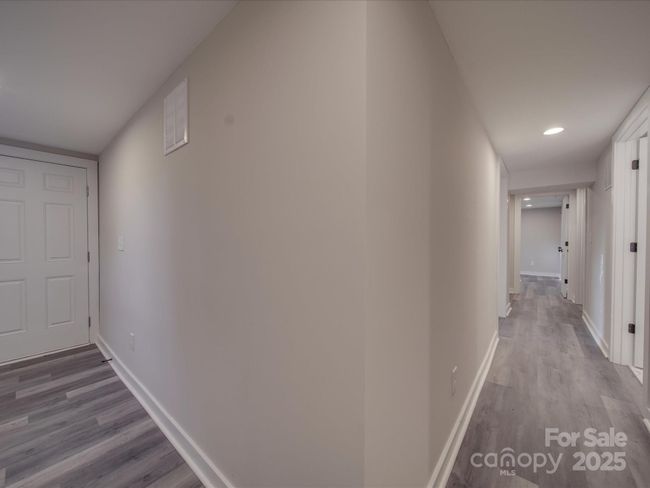downstairs hallway with exterior access. Opens to back yard. | Image 23