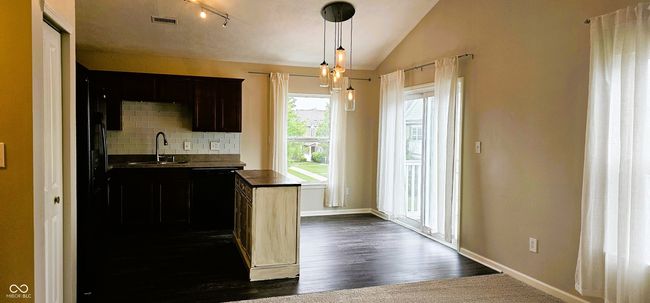 All kitchen appliances included. Cherry Cabinets and center island | Image 4