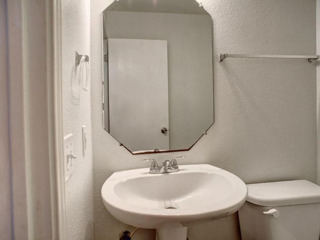 Main floor powder room at the base of the stairs | Image 15