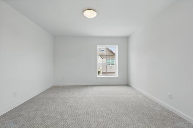 Unfurnished room with light colored carpet and baseboards | Image 28