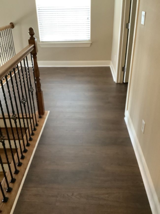 Corridor featuring dark wood finished floors and an upstairs landing | Image 11