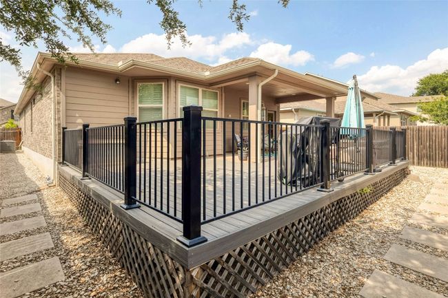 Rear view of property featuring a fenced backyard | Image 24
