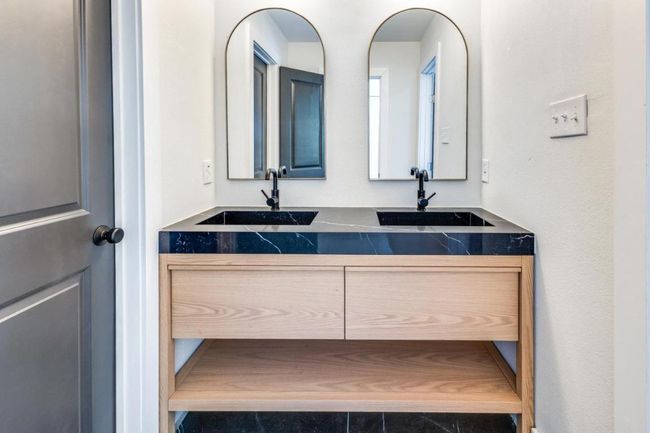Bathroom featuring double vanity and a sink | Image 18