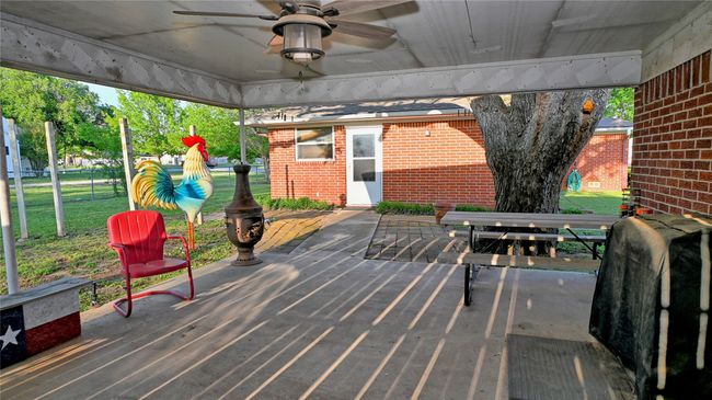 Wooden terrace with a ceiling fan | Image 12