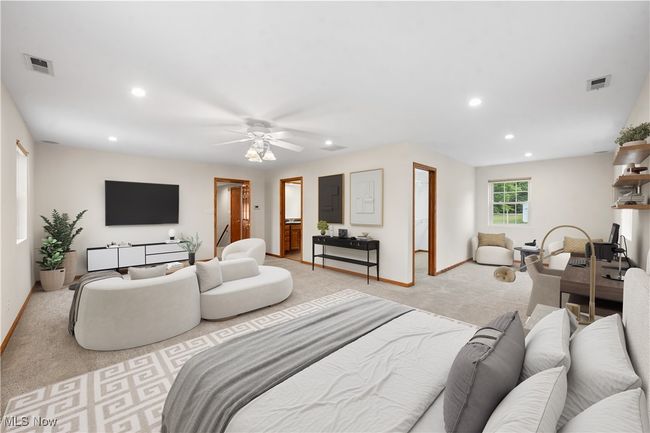 Carpeted living room with ceiling fan | Image 17