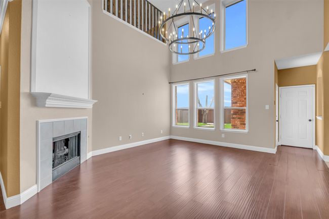 Living room featuring a high ceiling. | Image 12