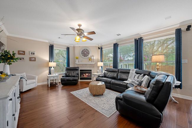 The family room has a fireplace and so much natural lighting | Image 10