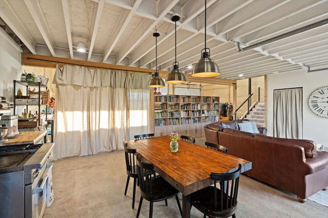 Dining room with concrete floors | Image 22