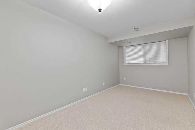 76 Coach Gate Way Sw, House other with 3 bedrooms, 2 bathrooms and 4 parking in Calgary AB | Image 34