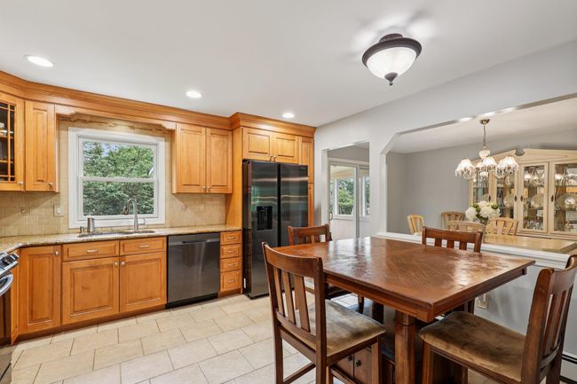 Kitchen with stainless steel appliances, decorative backsplash, healthy amount of natural light, and recessed lighting | Image 9