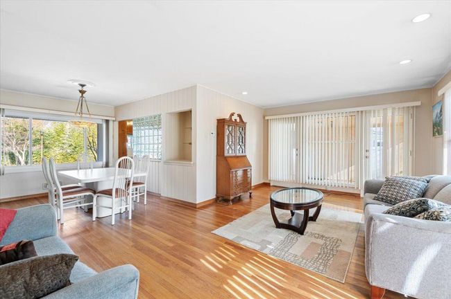 Living room featuring light hardwood / wood-style flooring | Image 4