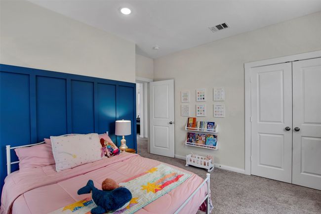 Bedroom featuring light colored carpet and a closet | Image 25