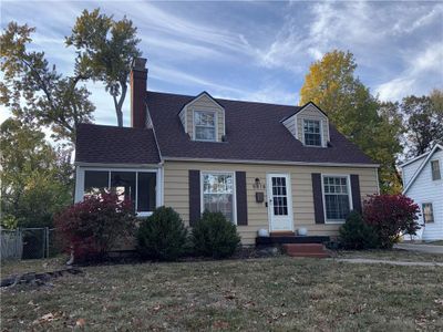 New england style home with a front yard | Image 2