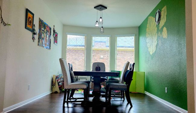 Dining area featuring healthy amount of natural light and wood finished floors | Image 13