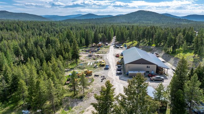 View from above of property with a forest and a mountain backdrop | Image 84