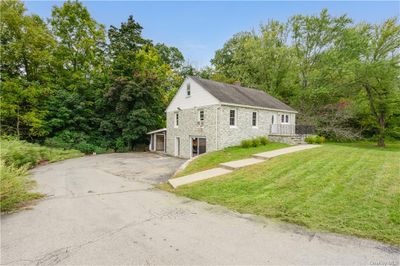 View of side of property featuring a lawn | Image 1