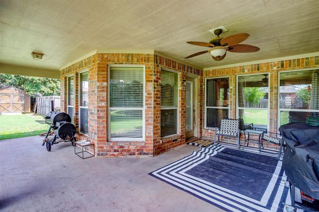 View of patio featuring a ceiling fan | Image 35