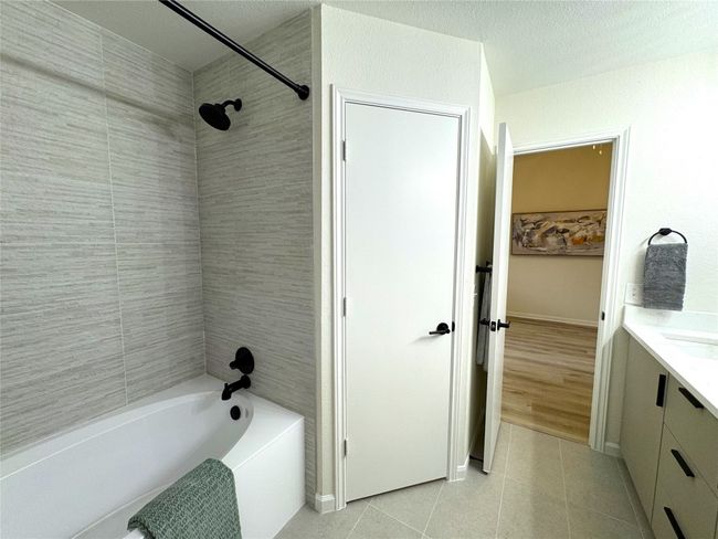 Love the stone tile that goes to the ceiling. Updated fixtures! | Image 14
