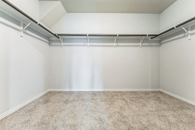 Walk in closet featuring carpet flooring | Image 14