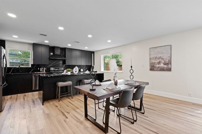 Dining room featuring plenty of natural light, light wood-style flooring, recessed lighting, and baseboards | Image 4
