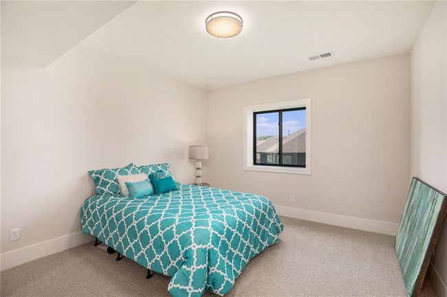 Bedroom featuring carpet flooring and baseboards | Image 28