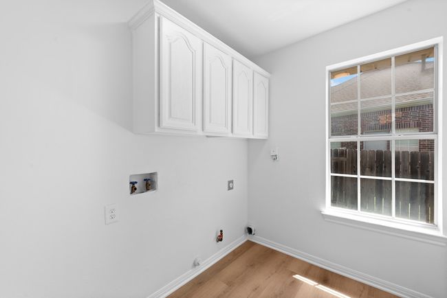 Laundry room located off of the kitchen | Image 20