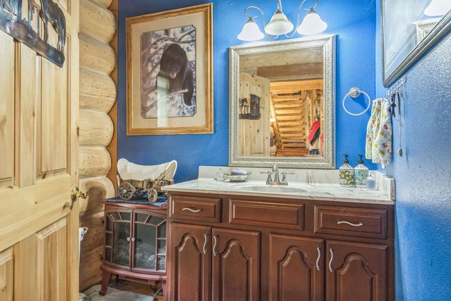 Bathroom featuring vanity and a textured wall | Image 42