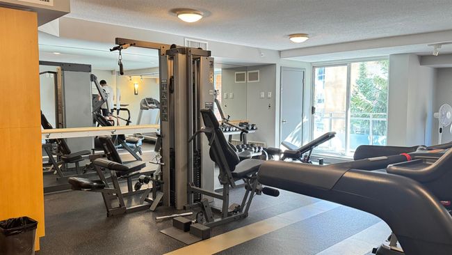 Workout area with visible vents and a textured ceiling | Image 8