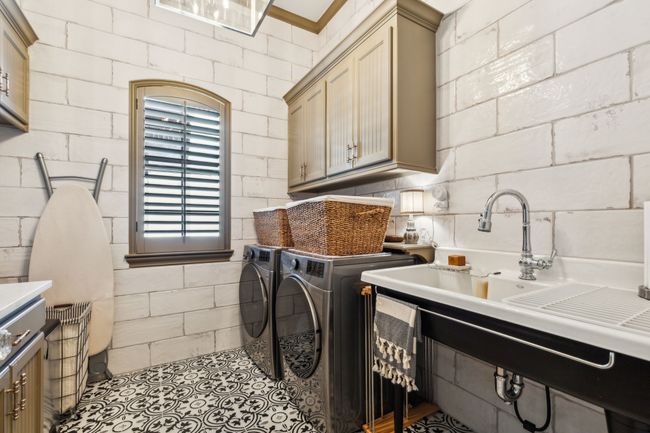 Laundry Room Features Floor-to-Ceiling Vintage Tile, a Kohler Cast Iron Sink, and LG Appliances | Image 23