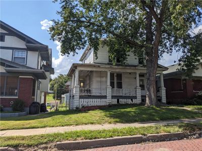 View of front of home with a porch and a front lawn | Image 1