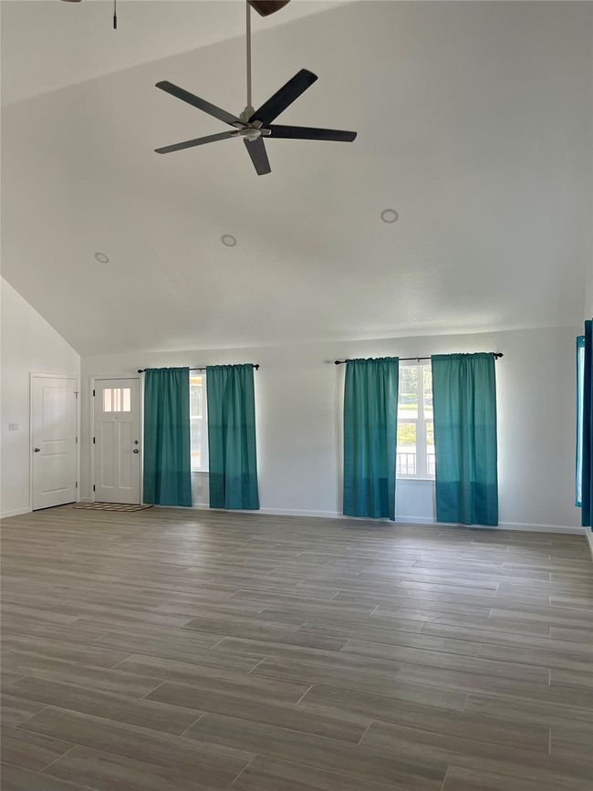Spacious family room with high ceilings | Image 8
