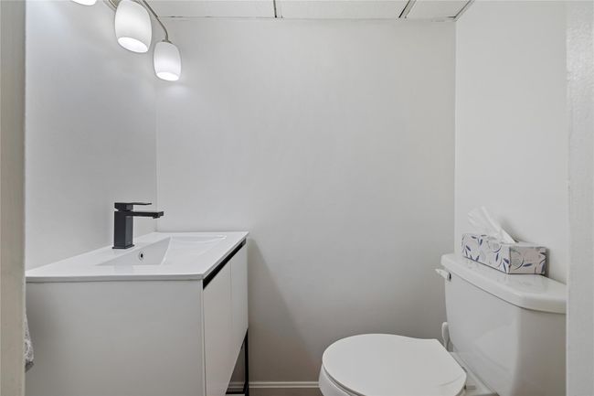 Bathroom featuring toilet and vanity | Image 37