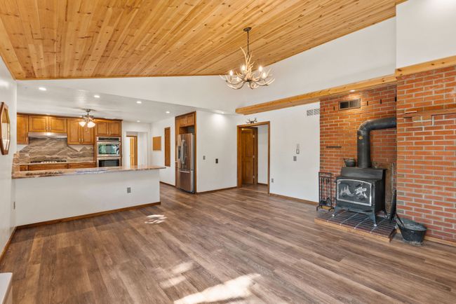 Dining area with a wood stove | Image 16