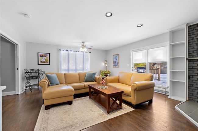 Living room featuring a ceiling fan, recessed lighting, and dark wood-style flooring | Image 20