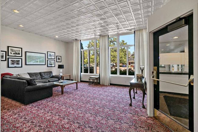 The shared lobby of the condos has photos sharing the history of this historic building. | Image 33