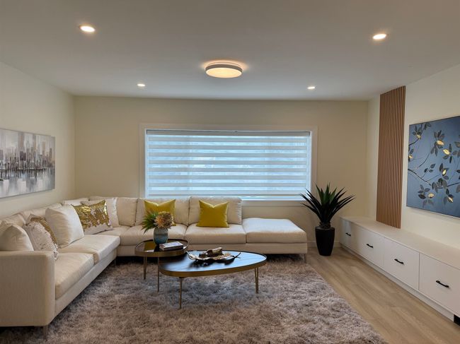Living room with recessed lighting and light wood finished floors | Image 9