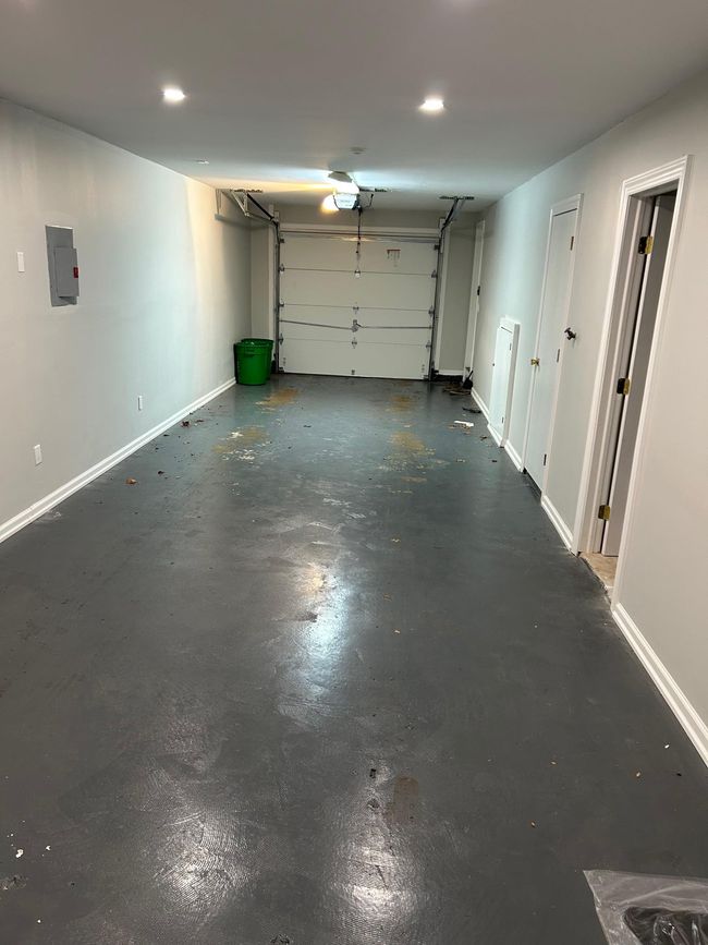 Garage featuring electric panel and baseboards | Image 41