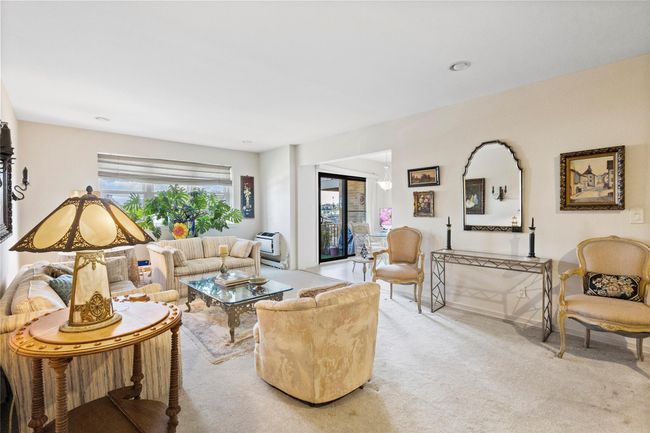 Living area with light colored carpet | Image 15