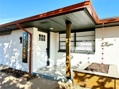 Your charming home awaits you. You'll love the stunning entrance with custom letterings and beautiful brass gutters | Image 1