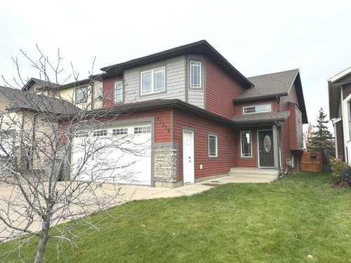 11318 105 A Avenue, House with 4 bedrooms, 3 bathrooms and 4 parking in Grande Prairie AB | Card Image
