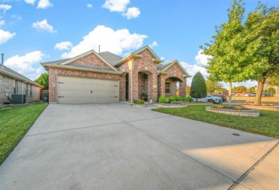 View of front of house with a front yard, central AC unit, and a garage | Image 3