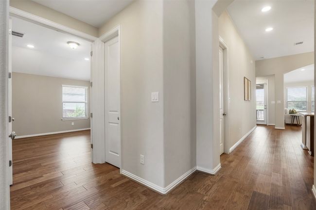 Hallway to private office and looking towards the kitchen/family room | Image 19