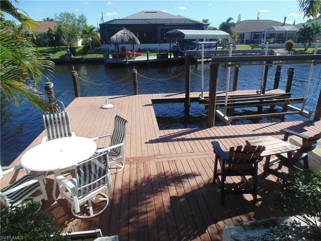 View of dock featuring a water view and boat lift | Image 37