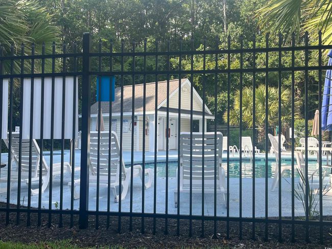 Gate with a community pool and a patio | Image 38