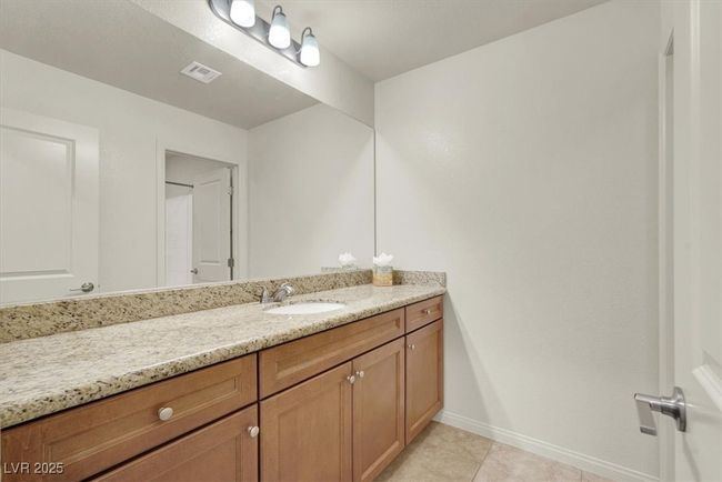 Bathroom with vanity and tile patterned flooring | Image 50